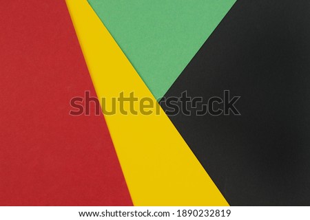 February Black History Month. Abstract Paper geometric black, red, yellow, green background. Copy space, place for your text. Top view.