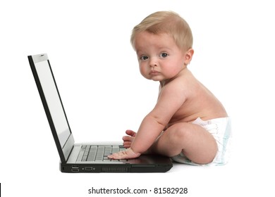 Fed Up Expression On A Baby Boys Face Whilst Getting Into Mischief On A Laptop Computer