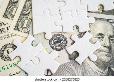 FED The Federal Reserve System with jigsaw puzzle paper, the central banking system of the United States of America. - Shutterstock ID 2208276823