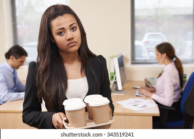 Fed Up Female Intern Fetching Coffee In Office