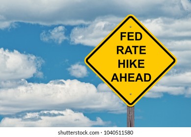 Fed Rate Hike Ahead - Caution Sign Blue Sky Background 