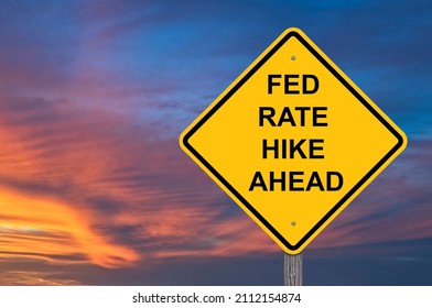 Fed Rate Hike Ahead Caution Sign - Sunset Background - Shutterstock ID 2112154874