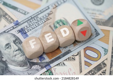 FED wording with up and down arrow on USD dollar banknote for Federal reserve increase and decrease interest rate control which effect to America and world economic growth concept. - Shutterstock ID 2184828149