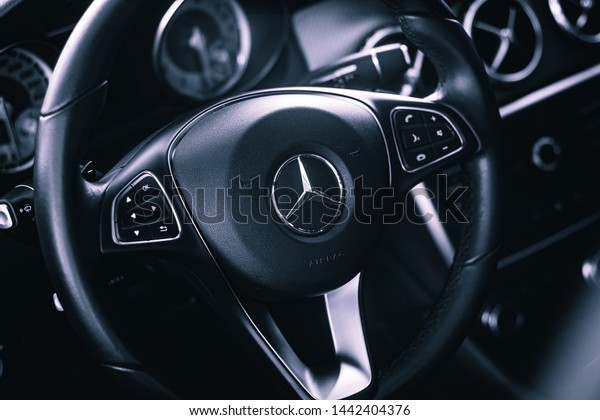 Brasília,\
Federal District - Brazil. July 4, 2019. Photograph of the interior\
of a vehicle Mercedes-Benz GLA 200 2016. Highlight the photo for\
the steering wheel with the company\
logo.