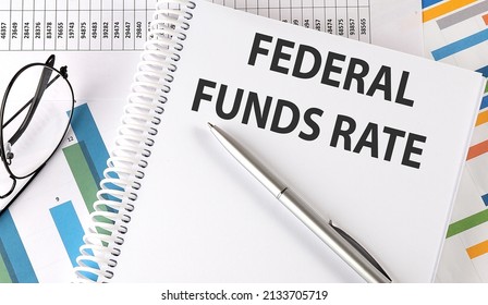 FEDERAL FUNDS RATE Text , Pen And Glasses On Chart