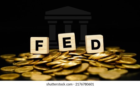 The Federal Reserve (FED) concept to control interest rates. World economy crisis gold coin background. Business concept. - Shutterstock ID 2176780601