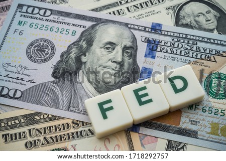 The Federal Reserve ( FED ) to control interest rates. World economy crisis, U.S. vs China trade or currency war concept. Interest rates affect the ability of consumers or businesses to access credit.