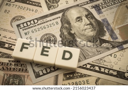 The Federal Reserve ( FED ) to control interest rates. World economy crisis, U.S. vs China trade or currency war concept. Interest rates affect the ability of consumers or businesses to access credit.