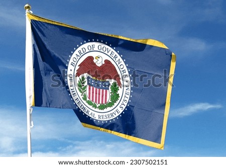Federal Reserve flag in cloudy sky. waving in the sky