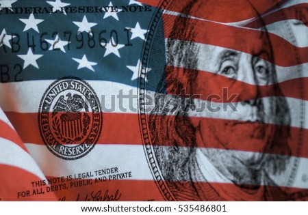 Federal reserve system symbol on hundred dollar bill with united states of america flag