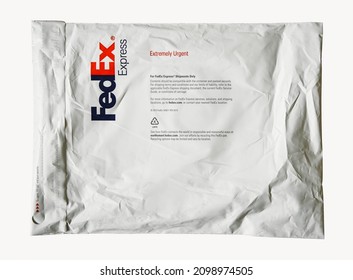 FedEx Express parcel. Lifestyle picture of the FedEx shipping bag on white background