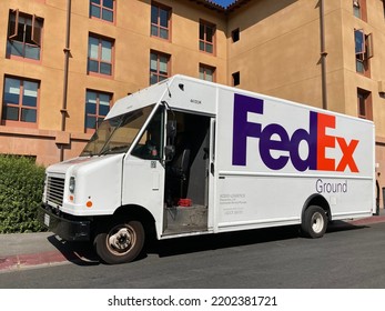 FedEx Ground Delivery Truck At Residential Building. Side And Front View - San Jose, California, USA - September, 2022