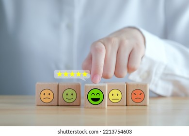 Feedback Rating And Positive Service Review. Customer Experience, Mental Health Assessment, World Mental Health Day, Think Positive, Emotion, Satisfaction Survey. Hand Choosing Happy Face With 5 Star.