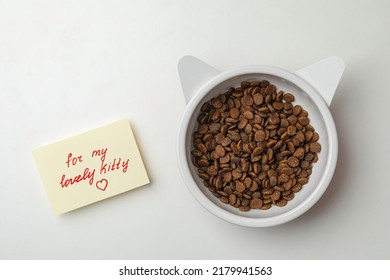 Feeding Bowl Of Kibble With Cat Ears And Cute Note For My Lovely Kitty On White Background, Flat Lay