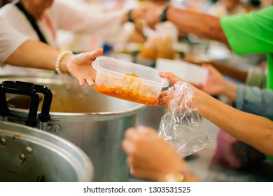 Feeding concept, Food donation, Helping people in society - Shutterstock ID 1303531525