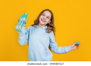 feel thirsty. protein and vitamin bottle. happy and healthy teen girl. fit child drink water after training. sport is life. athletic kid care of water balance in body. hydration. quench thirst - Powered by Shutterstock