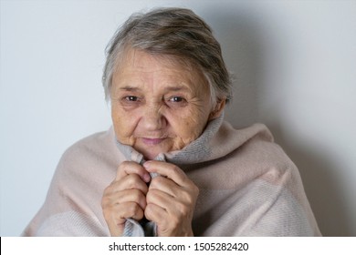 Feeling Cold. Portrait Of A Cheerless Aged Woman While Feeling Cold. Older  Woman Is Having Flu And Sneezing From Sickness Seasonal Virus Problem. Fever And Cold In Senior People With Influenza Illnes