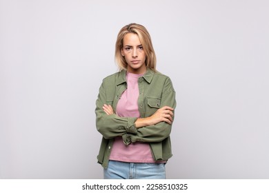  feeling displeased and disappointed, looking serious, annoyed and angry with crossed arms - Shutterstock ID 2258510325
