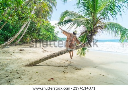 The feeling of freedom on the beach in a tropical paradise. Costa Rica, Caribbean coast.