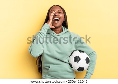 feeling happy, excited and positive, giving a big shout out with hands next to mouth, calling out. soccer concept