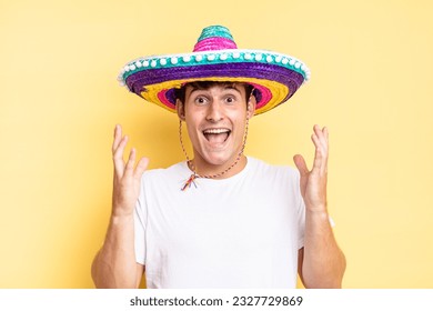 feeling happy, excited, surprised or shocked, smiling and astonished at something unbelievable. mexican hat concept