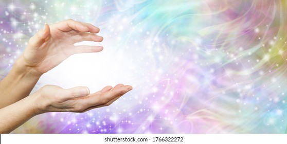 Feeling Healing Energy Between Hands - a pair of female hands with a white energy orb between on an ethereal pink and purple  energy field background  - Shutterstock ID 1766322272