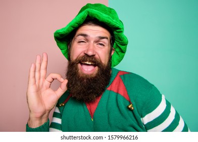 Feeling Ok. Happy Celebration. Cheerful Man With Beard Have Fun. Ireland Beer Tradition. Winter Carnival. Irish Pub Party. St Patricks Day. Happy Bearded Hipster In Green Hat. Christmas Elf.