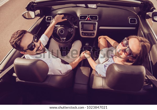 Feelings,\
married family, friendship, reach destination, escape, speed ride\
lifestyle. Carefree driver husband, lady wife hold arms, on their\
way to dreams and happiness, highway,\
honeymoon
