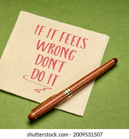 If It Feels Wrong Do Not Do It Advice, Handwriting On A Napkin With A Cup Of Coffee, Instinct And Gut Feeling Concept