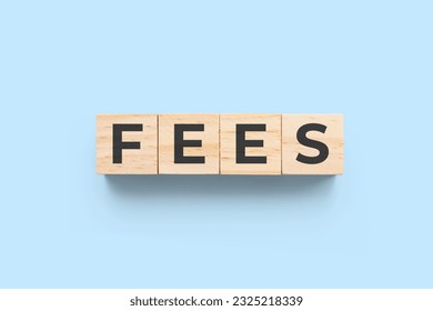 Fees wooden cubes on blue background - Shutterstock ID 2325218339