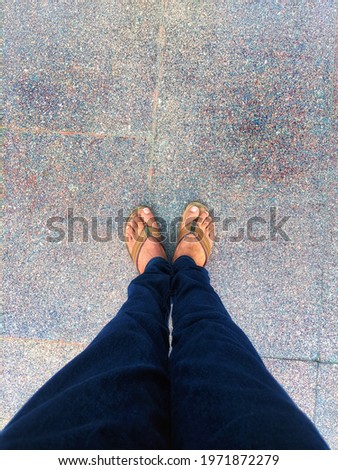 Feet background photo in slippers, fresh morning start with nature