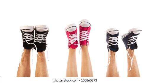 Feet In Basketball Shoes Isolated Over White Background