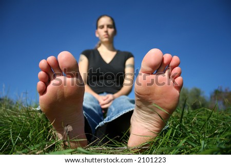 feet and blurred woman