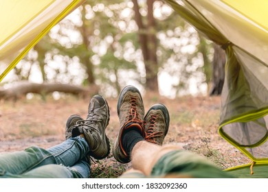 Feet in boots in tent opening