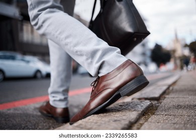 Feet, business man and walking on city road or ground for travel, journey and commute to work. Shoes, legs and closeup of a professional person or employee crossing an urban street with a bag - Powered by Shutterstock