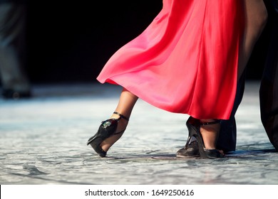 Feet Closeup Of Argentinian Tango Dancer In A Red Dress. Argentina Tango.