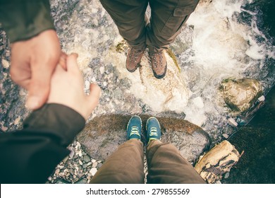 Feet Couple Man And Women In Love Holding Hands Hiking Outdoor Lifestyle Travel And Relationship Concept River And Stones On Background Top View