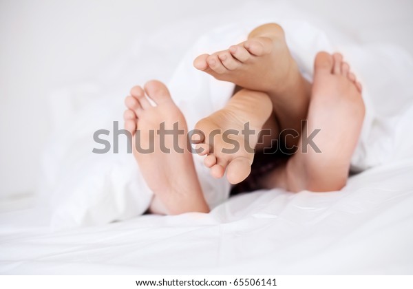 Feet Couple Under Blanket Stock Photo Edit Now 65506141