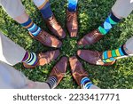 Feet and dress shoes of groomsmen at wedding showing off their colorful fancy socks