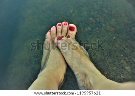 Feet at the edge of the Creek