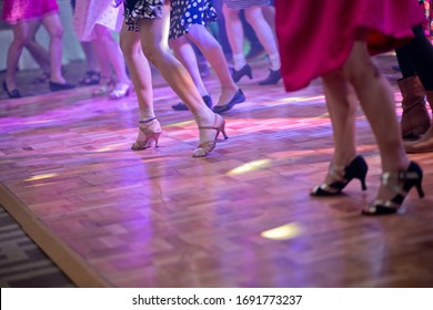 Feet Of Female Dancing On A Club Party.