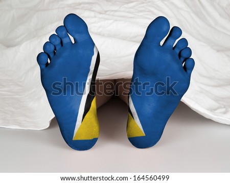 Feet with flag, sleeping or death concept, flag of Saint Lucia