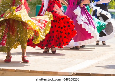 Feet Of Flamenco Dancers, Performing On A Wooden Stage In Summer City Festival