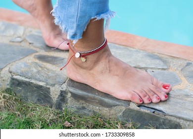 Feet And Foot With Accesories In The Pool Or Water