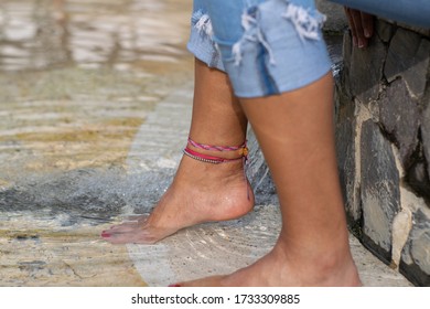 Feet And Foot With Accesories In The Pool Or Water