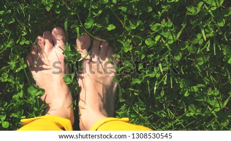 feet in green grass spring toning