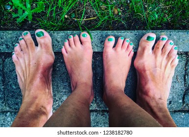 Feet With Green Nail Polish.