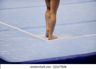 Feet Of Gymnast Are Seen On The Floor Exercise During Gymnastics Competition