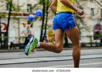 feet male athlete runner running on city street marathon - Powered by Shutterstock