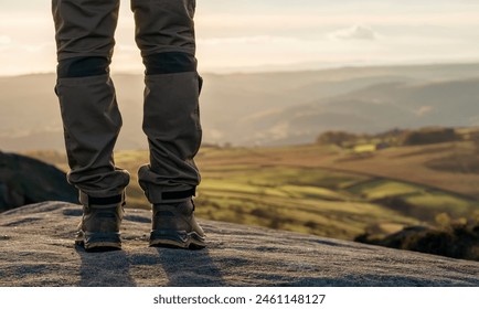 feet of man in boots reaching destination at sunset Travel Lifestyle concept